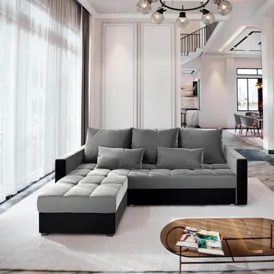 A modern living room with a sectional sofa and a coffee table.
