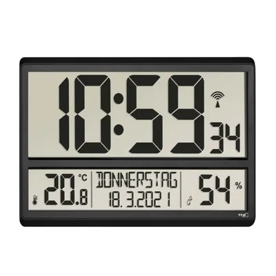 A digital clock displaying time, date, temperature, and humidity.