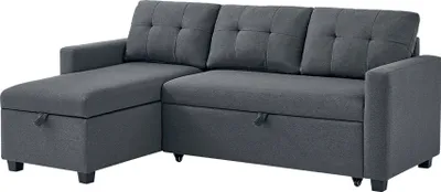 A dark gray sectional sofa with a chaise lounge is shown against a white background.