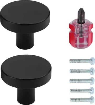 Two black cabinet knobs with screws and a small screwdriver are arranged on a white background.