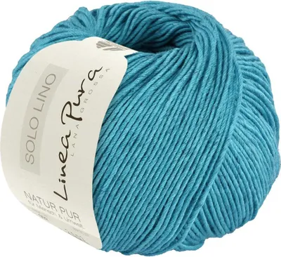A ball of teal yarn with a label.