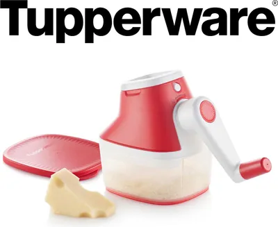 A Tupperware cheese grater with a piece of cheese and a lid.
