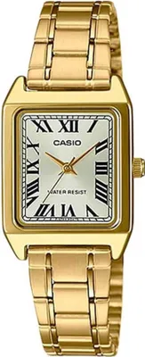 A close-up studio shot of a gold-tone Casio watch with a rectangular face and Roman numerals.