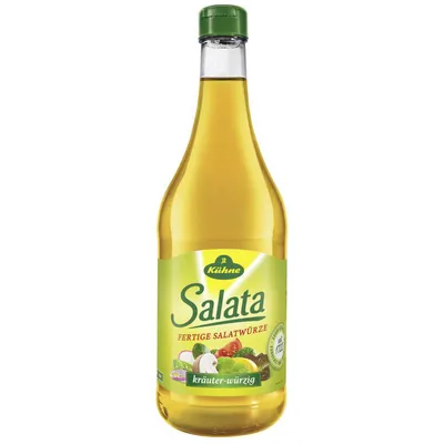 A bottle of Kühne Salata dressing with a green cap and a label featuring vegetables.
