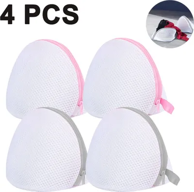 Four white mesh laundry bags with colored zippers, arranged in a two-by-two grid.