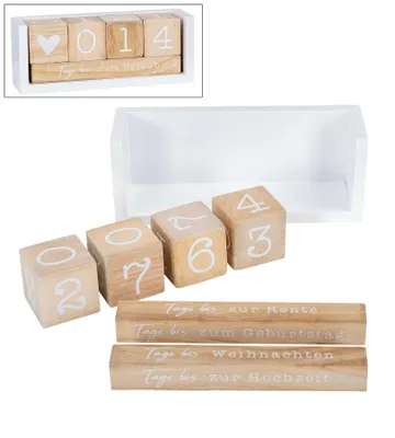A wooden countdown calendar with blocks and themed strips, displayed with a white tray.