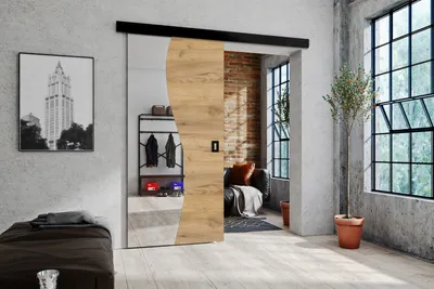 A modern interior with a sliding door, a bed, and a window.