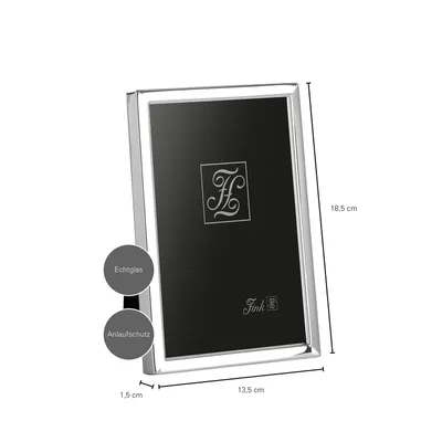 A product shot of a silver picture frame with dimensions indicated.