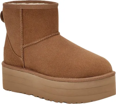 A single brown UGG boot with a platform sole is shown against a white background.