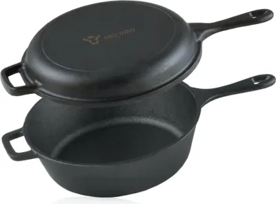 A black cast iron pot and its lid are stacked on a white background.