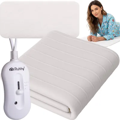 A woman is lying on a heated blanket, with a controller and another heated blanket in the foreground.