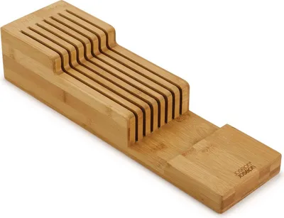 A wooden knife organizer for drawers.