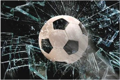 Produktbild von Wallario Wandbild Fußball - im Fenster, Splitter und Glas, Größe: 61 x 91,5 cm, Poster mit rahmenlosen Bildhalter