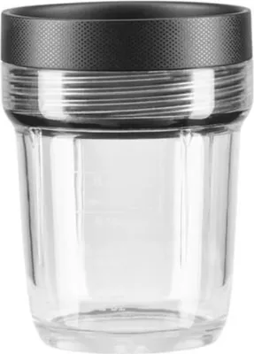 A clear studio shot of a glass mixing container with a black textured lid.