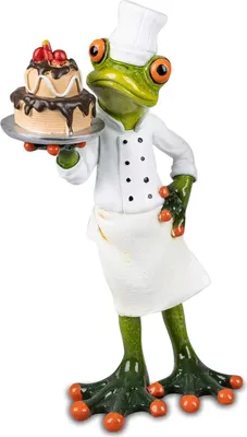 A figurine of a frog dressed as a chef, holding a cake.