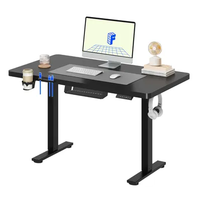 A black standing desk with a computer monitor, keyboard, mouse, and accessories.