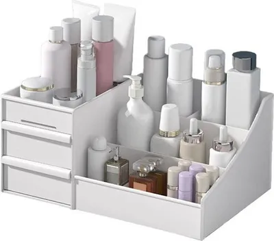 A white makeup organizer filled with various cosmetic bottles and containers.