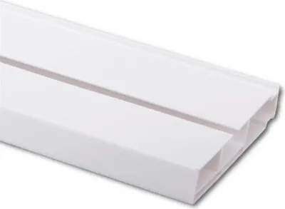 A close-up, angled view of a white plastic curtain rail with a groove down the middle.