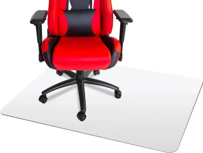 A red and black gaming chair is placed on a clear floor mat.