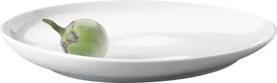 A single green eggplant on a white plate.
