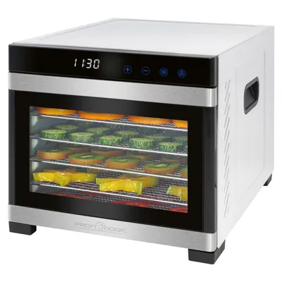 A food dehydrator with multiple trays filled with sliced fruits and vegetables.