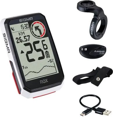 A collection of bicycle computer accessories, including the main unit, a handlebar mount, a heart rate monitor, and a charging cable.