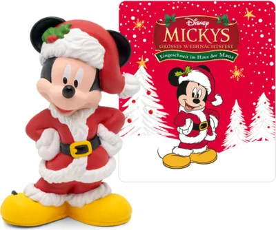 A Mickey Mouse figurine dressed as Santa Claus stands next to a Christmas-themed card featuring Mickey Mouse and holiday imagery.