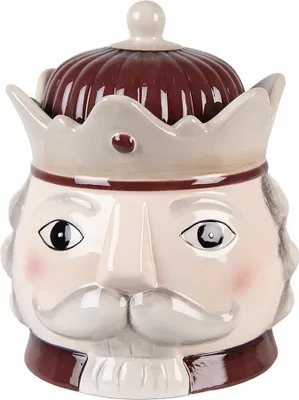 A ceramic nutcracker-shaped jar with a crown lid.
