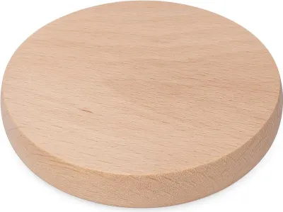 A round wooden cutting board on a white background.