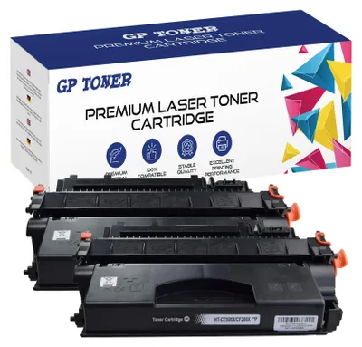 A box of GP Toner premium laser toner cartridges with several cartridges stacked in front.