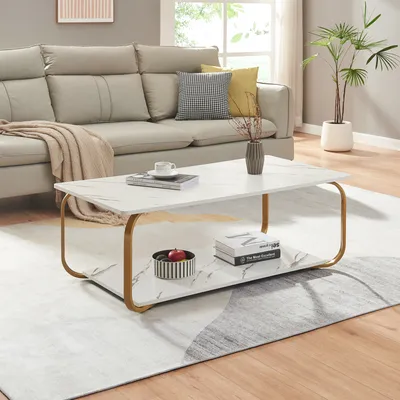 A living room scene with a couch, coffee table, and rug.