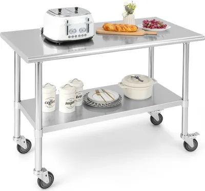 A stainless steel kitchen cart with kitchen items on it.