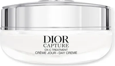A close-up studio shot of a Dior Capture OX-C Treatment Day Creme jar.
