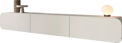 A modern, minimalist TV lowboard with rounded edges, displayed on a white background. Decorative objects, including a cylindrical vase and a small pedestal, are placed on the top surface, along with a globe-shaped lamp.