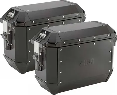 Two black motorcycle panniers are shown side-by-side against a white background.