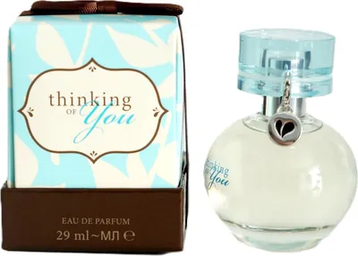 A perfume bottle and its packaging are displayed side-by-side against a white background.