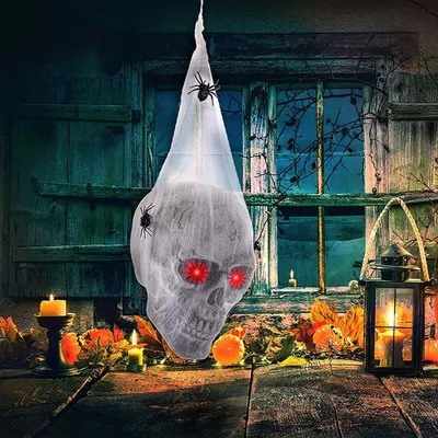 Produktbild von Halloween-Deko-Set: Leuchtender Schädel in Spinnweben lauert in Garten & Horror-Haus (Baumwolle)