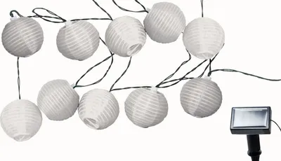 A string of white paper lanterns with a solar panel attached.