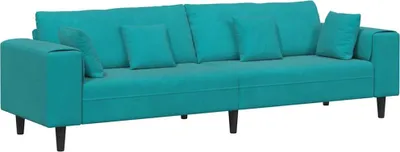 A studio shot of a turquoise sofa with cushions.