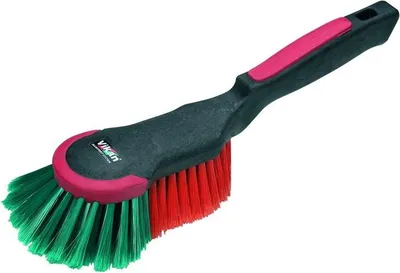 A cleaning brush with a black handle and red and green bristles, set against a white background.