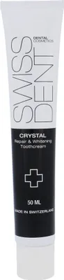 A tube of Swissdent Crystal Repair & Whitening Toothcream on a white background.
