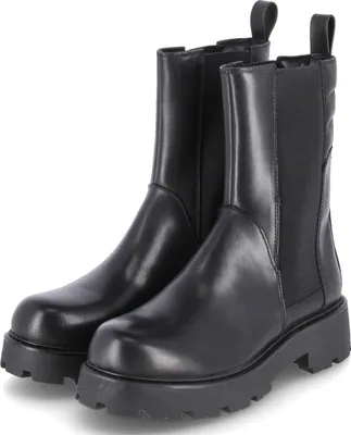 A pair of black leather Chelsea boots with thick soles, shown from the front.