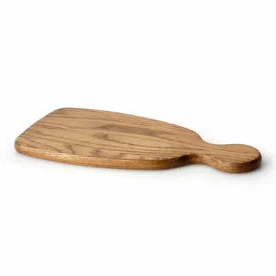 A wooden cutting board with a handle, shown from a side angle on a white background.