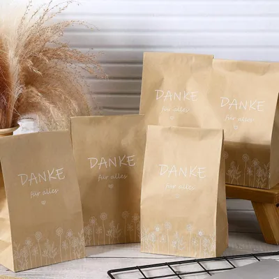 Produktbild von 100 Stück Kraftpapiertüten für Gastgeschenke bei Hochzeiten und Taufen. Perfekt für Firmung und Kommunionsfeiern.