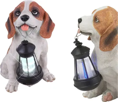 Two beagle dog figurines holding solar lanterns.