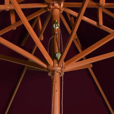 Close-up view of the internal structure of a wooden umbrella.