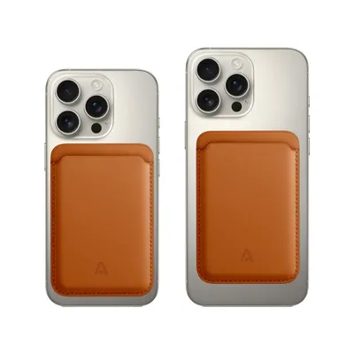Two iPhones with brown card holders attached to the back.