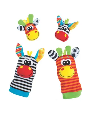 Four colorful baby toys shaped like animal heads and arms, arranged on a white background.