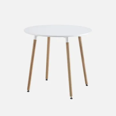 A white round table with three wooden legs against a plain white background.