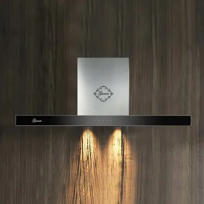 A modern kitchen range hood mounted on a wooden wall.